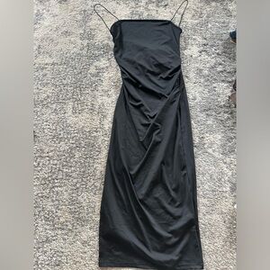 Medium slimming black maxi dress with front slit